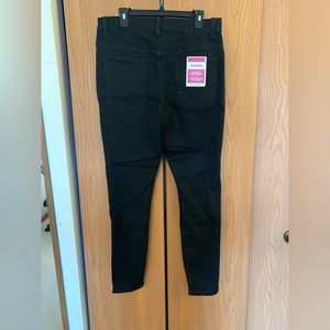 Distressed black skinny jeans